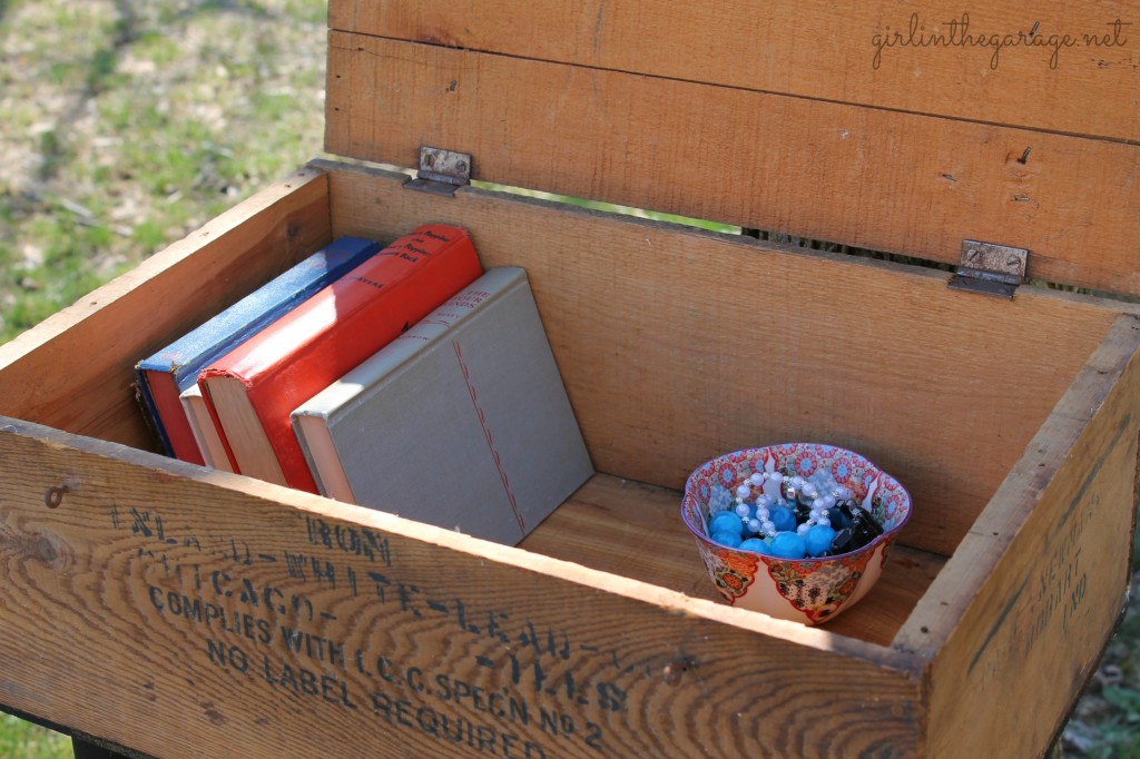 Upcycled old crate to "farmhouse chic" side table by adding legs and paint.  By Girl in the Garage