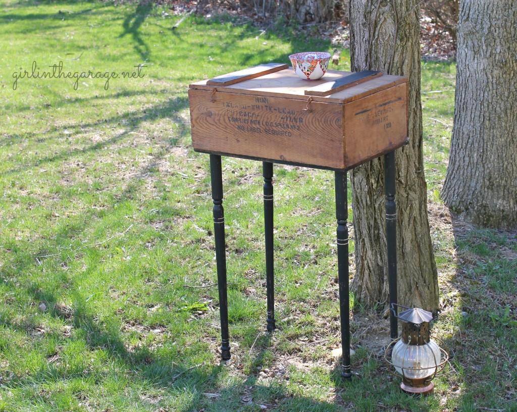 Upcycled old crate to "farmhouse chic" side table by adding legs and paint.  By Girl in the Garage