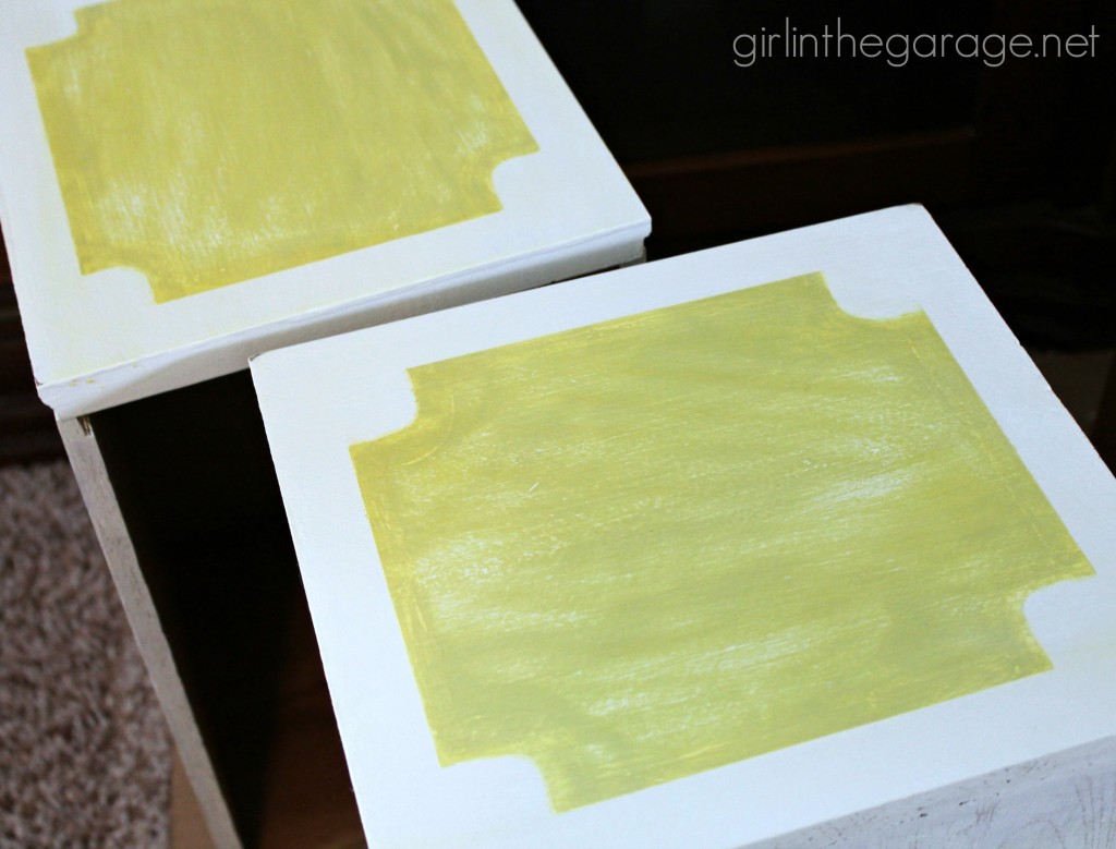 Bright white and yellow waterfall vanity makeover with Annie Sloan Chalk Paint and stenciled peekaboo drawers. Painted furniture ideas by Girl in the Garage