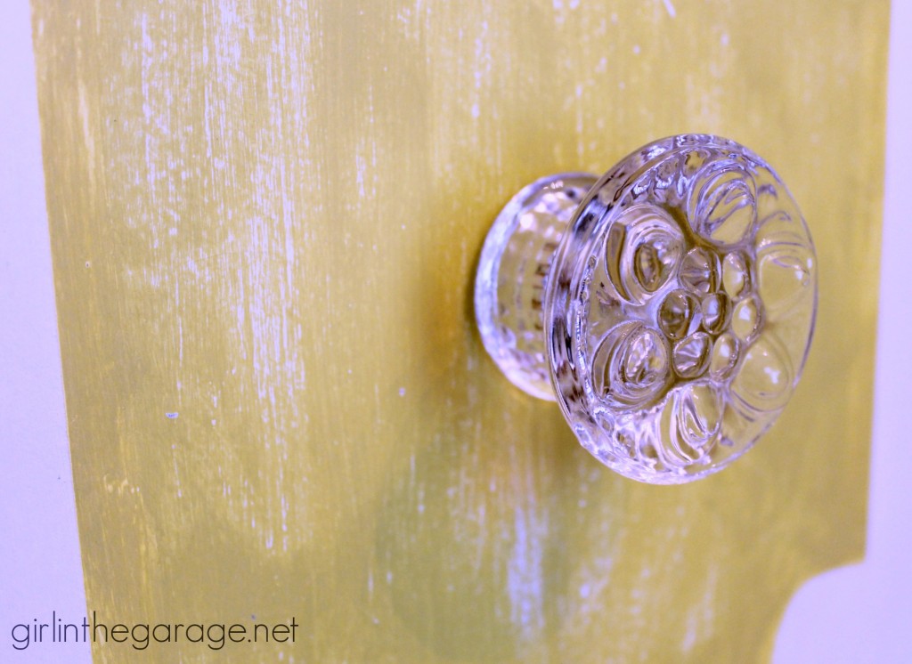 Bright white and yellow waterfall vanity makeover with Annie Sloan Chalk Paint and stenciled peekaboo drawers. Painted furniture ideas by Girl in the Garage