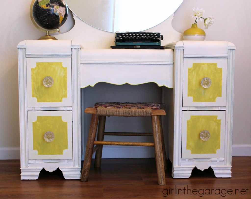 Bright white and yellow waterfall vanity makeover with Annie Sloan Chalk Paint and stenciled peekaboo drawers. Painted furniture ideas by Girl in the Garage