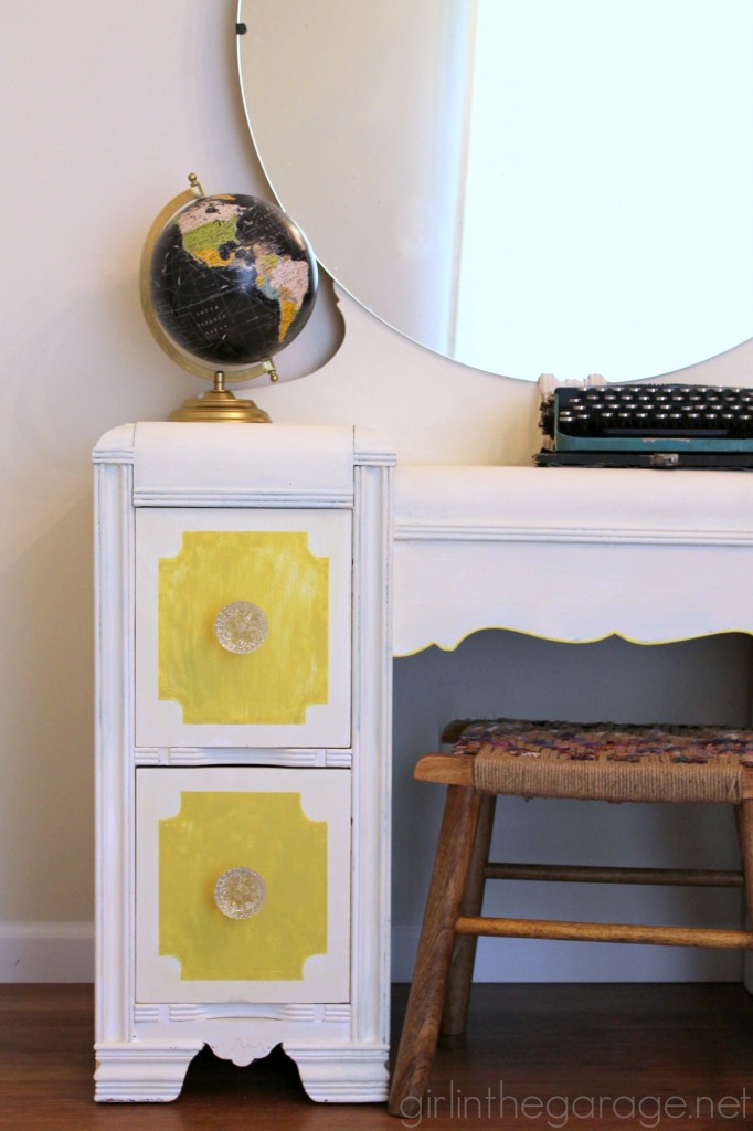 Bright white and yellow waterfall vanity makeover with Annie Sloan Chalk Paint and stenciled peekaboo drawers. Painted furniture ideas by Girl in the Garage