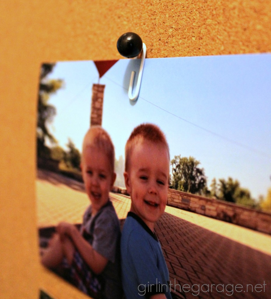 How to hang a photo on a cork board without poking a hole through it!  girlinthegarage.net