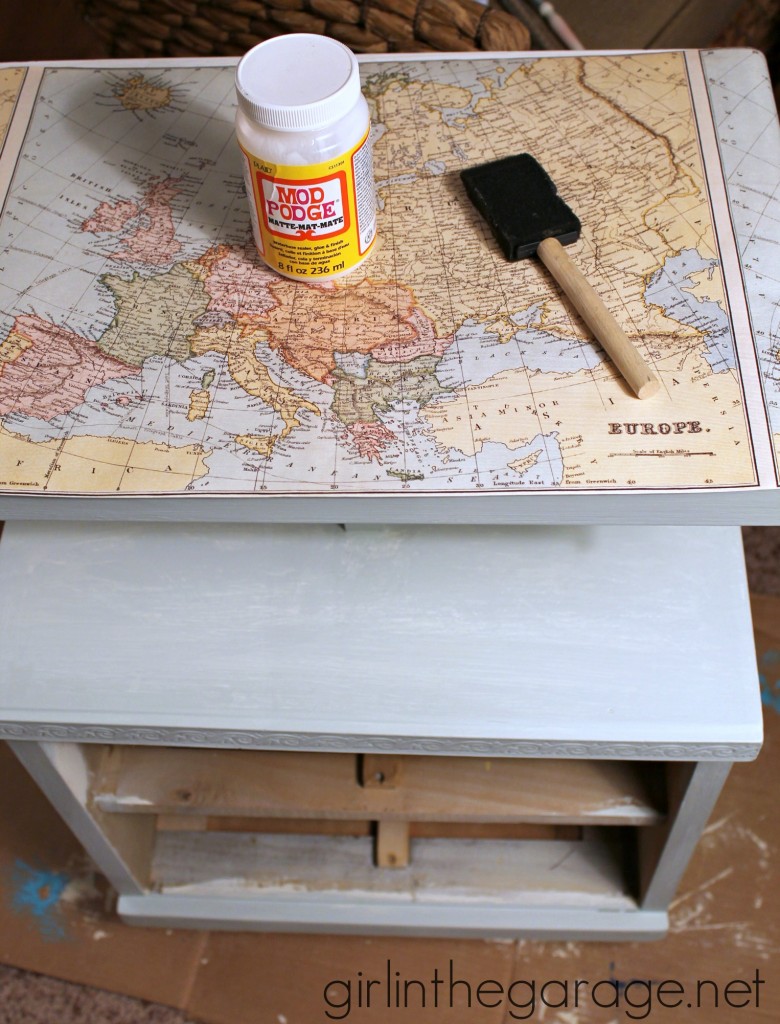 Decoupaged Map Table: Chalk Paint, Mod Podge, and maps.  "Travel" themed furniture makeover day - girlinthegarage.net