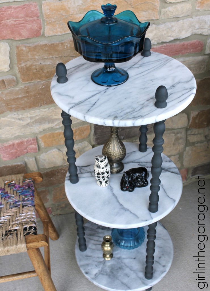 A marble table is updated with Graphite Chalk Paint on wooden spindles.  girlinthegarage.net