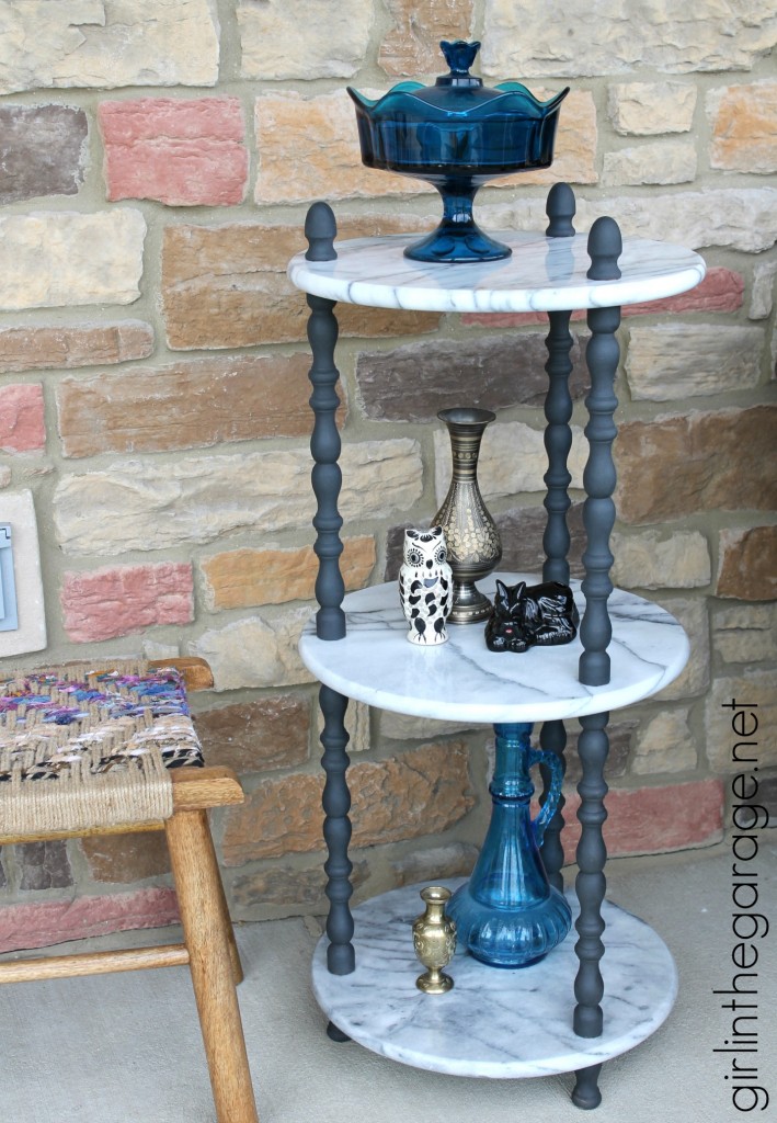 A marble table is updated with Graphite Chalk Paint on wooden spindles.  girlinthegarage.net