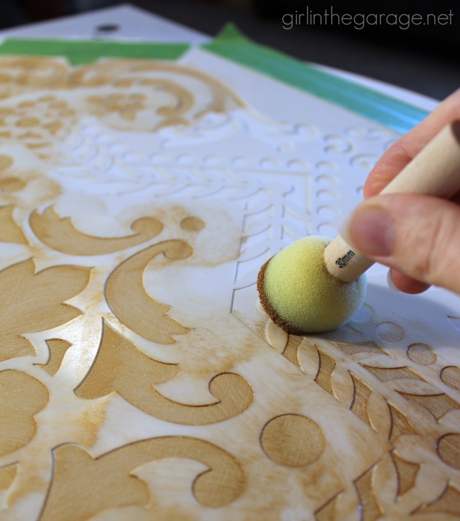 A stunning stenciled table makeover in metallic gold and white for Themed Furniture Makeover Day.   girlinthegarage.net