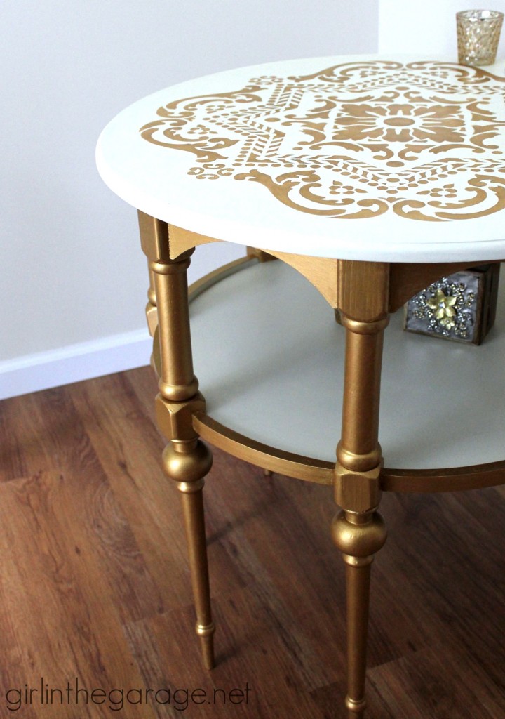 A stunning stenciled table makeover in metallic gold and white for Themed Furniture Makeover Day.   girlinthegarage.net