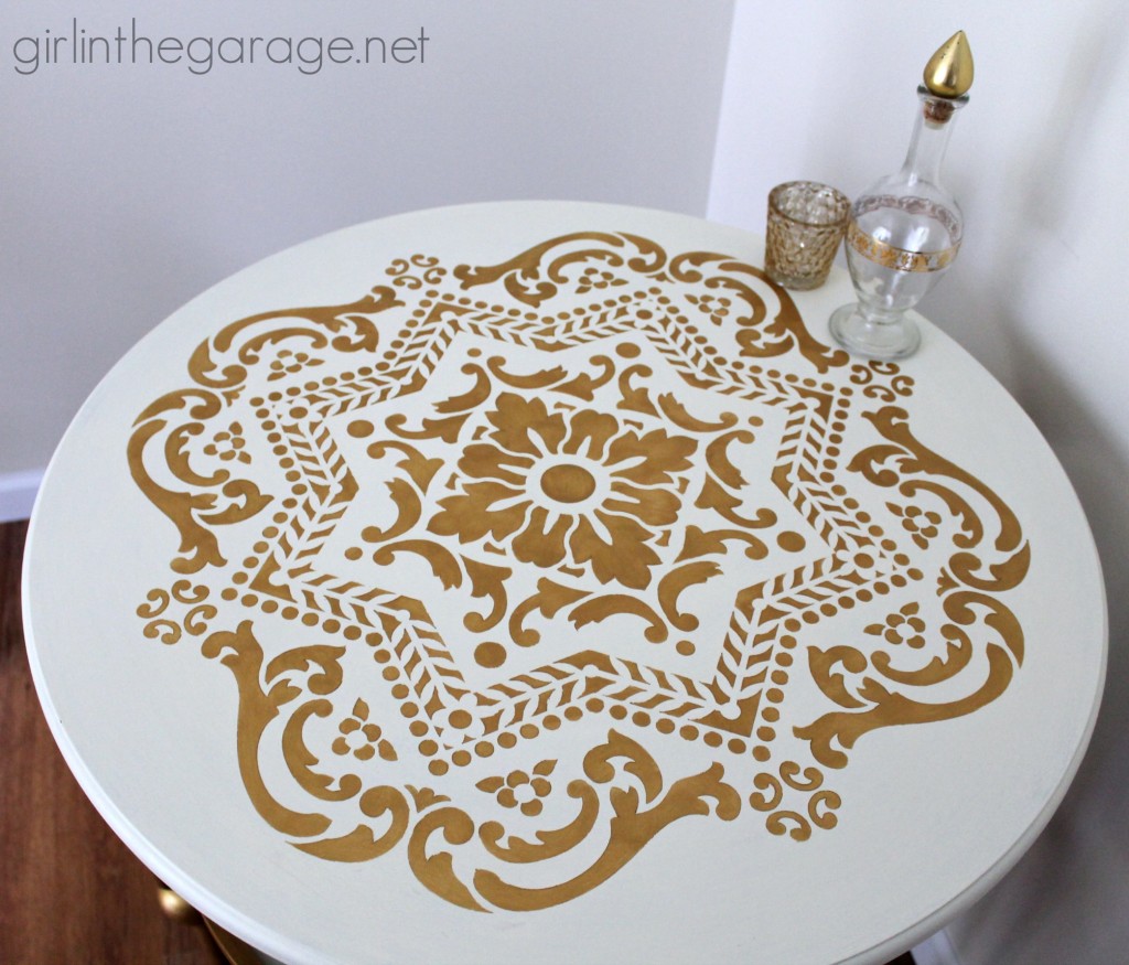 A stunning stenciled table makeover in metallic gold and white for Themed Furniture Makeover Day.   girlinthegarage.net