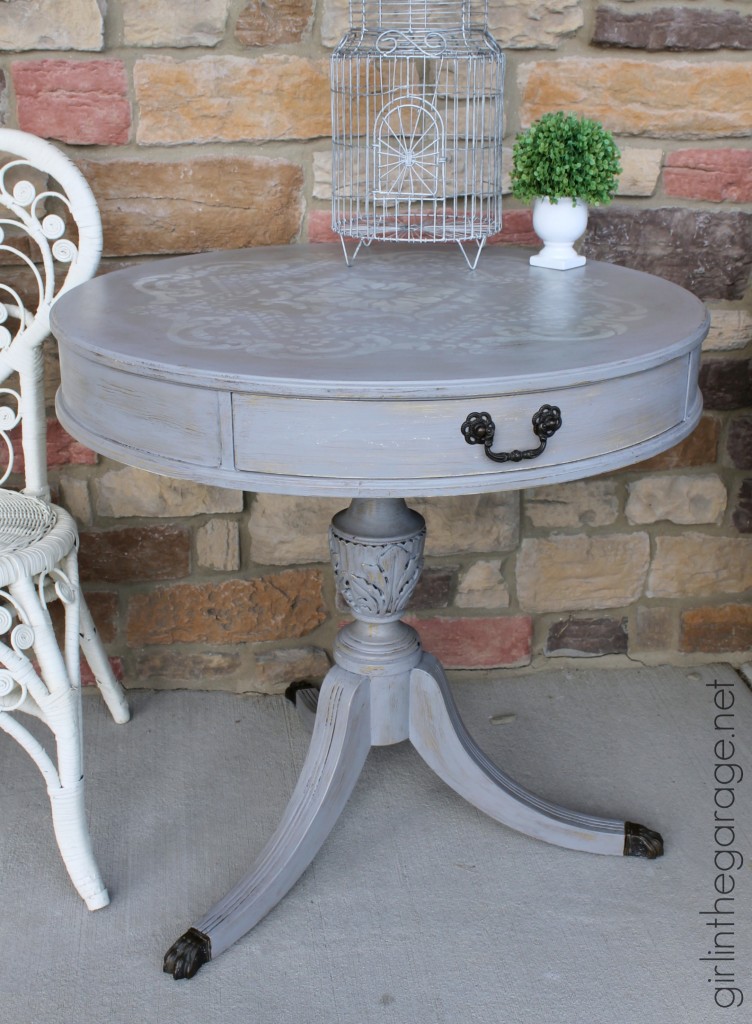 How to update an old table with a fabulous stencil and layered paint technique.  girlinthegarage.net