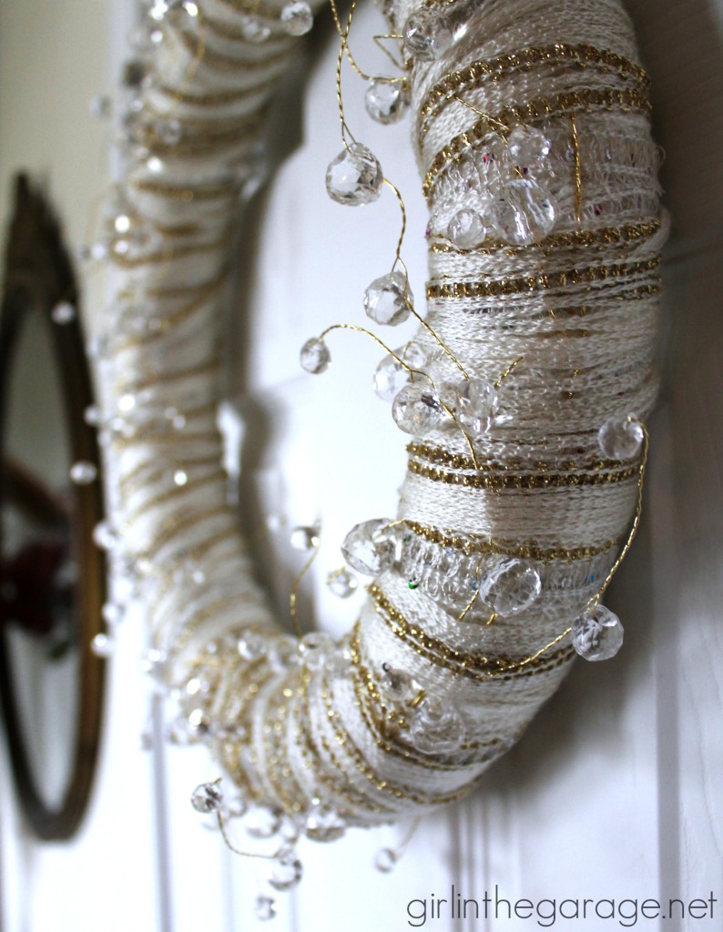 Easy DIY yarn wreath and foyer decorated for Christmas.  girlinthegarage.net