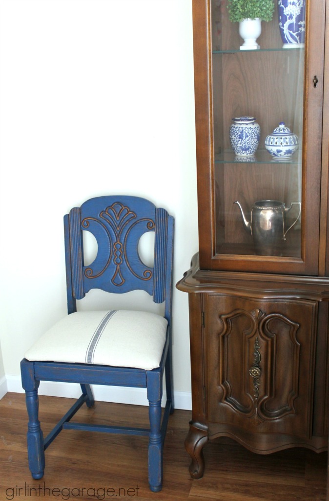 See how an outdated vintage chair got a French Country Chic makeover with new paint and grain sack fabric.  girlinthegarage.net