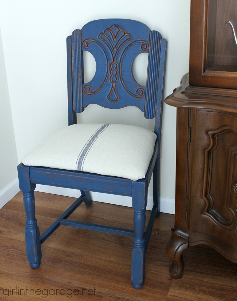 See how an outdated vintage chair got a French Country Chic makeover with new paint and grain sack fabric.  girlinthegarage.net