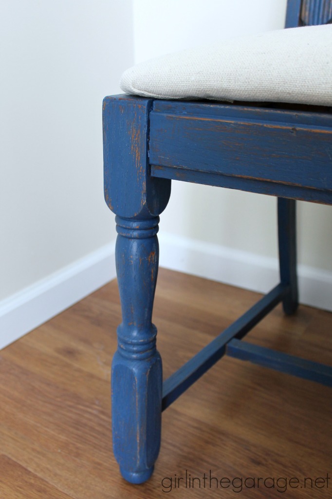 See how an outdated vintage chair got a French Country Chic makeover with new paint and grain sack fabric.  girlinthegarage.net