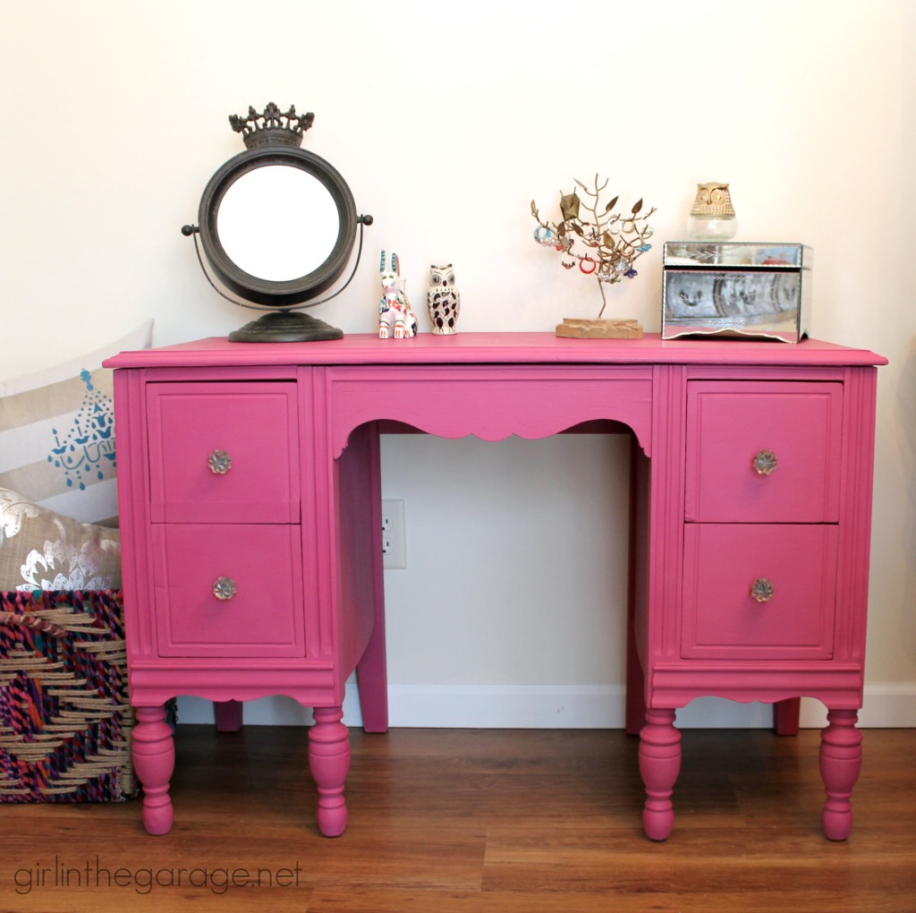 A vintage vanity gets a bright makeover for a little girl.  Custom pink color from Annie Sloan Chalk Paint.  girlinthegarage.net