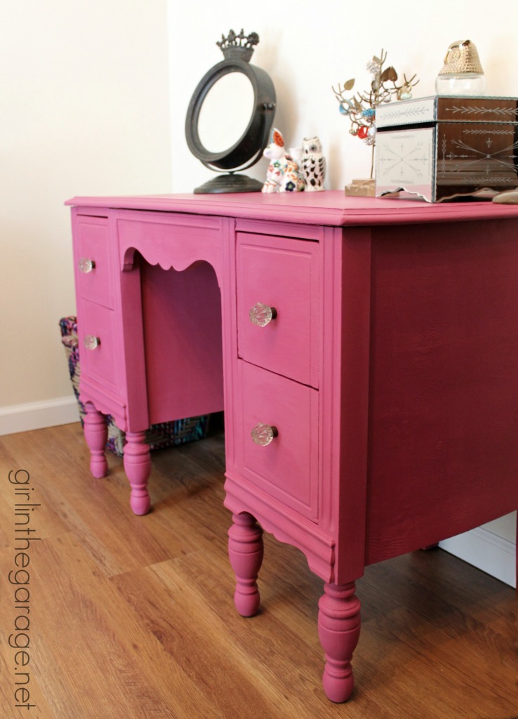 A vintage vanity gets a bright makeover for a little girl.  Custom pink color from Annie Sloan Chalk Paint.  girlinthegarage.net