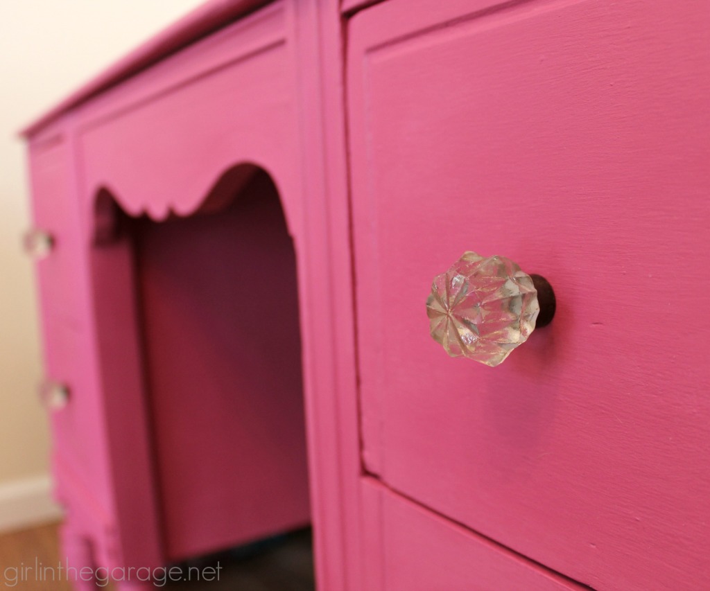 A vintage vanity gets a bright makeover for a little girl.  Custom pink color from Annie Sloan Chalk Paint.  girlinthegarage.net