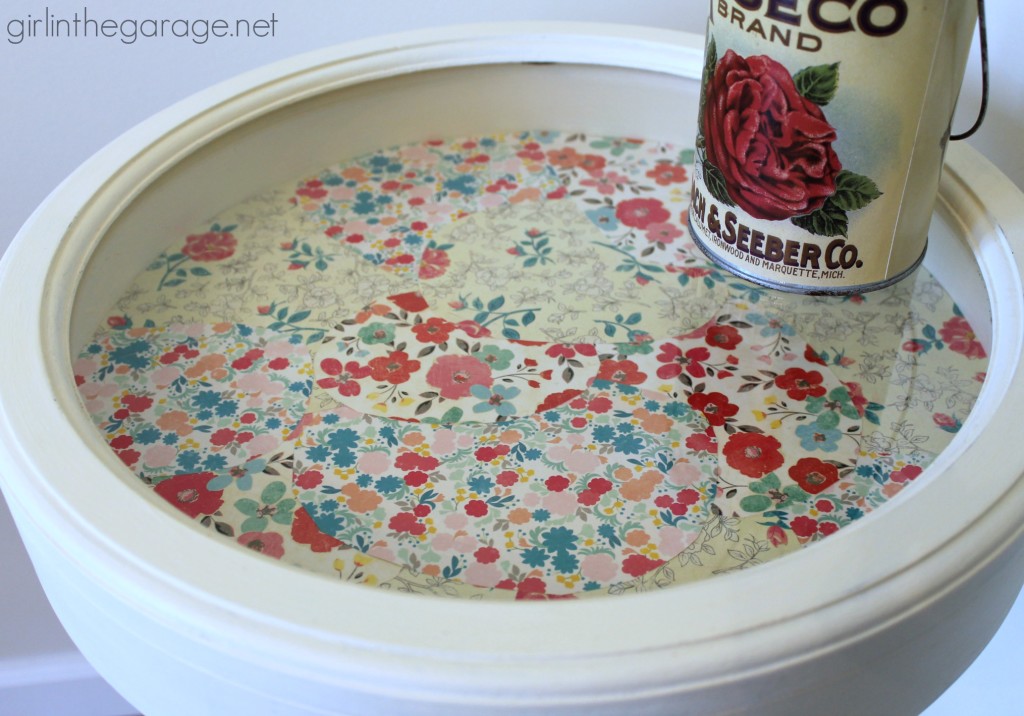 Add some personality to a plain table - paint it and decoupage pretty paper inside!   girlinthegarage.net