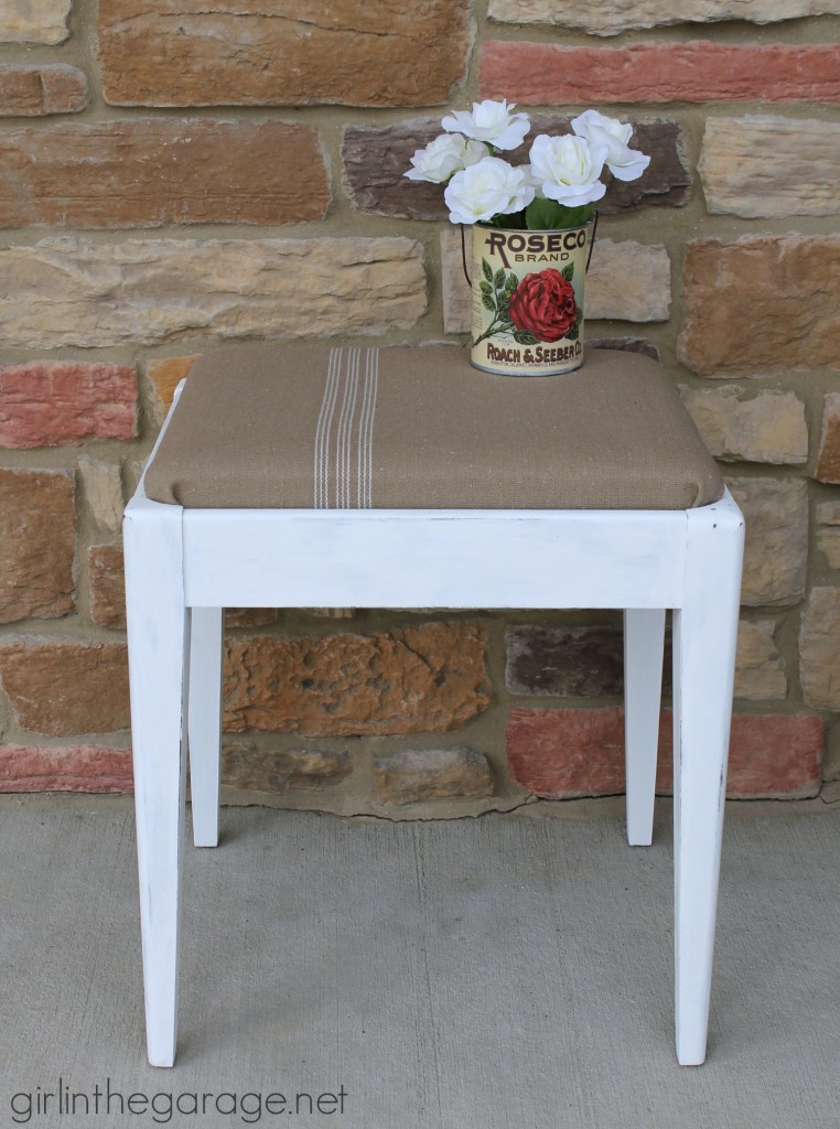 See how a plain Goodwill stool was given a vintage farmhouse makeover.  girlinthegarage.net