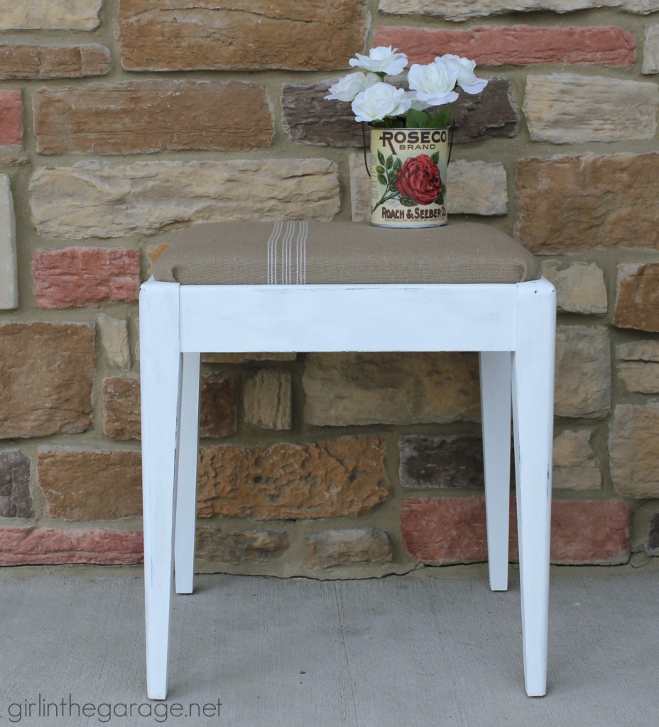 See how a plain Goodwill stool was given a vintage farmhouse makeover.  girlinthegarage.net