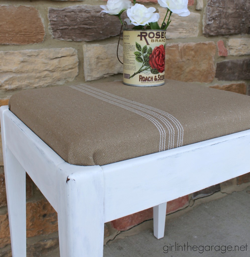 See how a plain Goodwill stool was given a vintage farmhouse makeover.  girlinthegarage.net