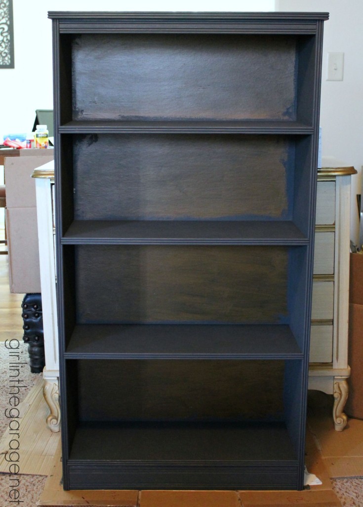 Decoupage Bookcase: How to update a boring bookcase with paint, pretty paper, and Mod Podge. girlinthegarage.net