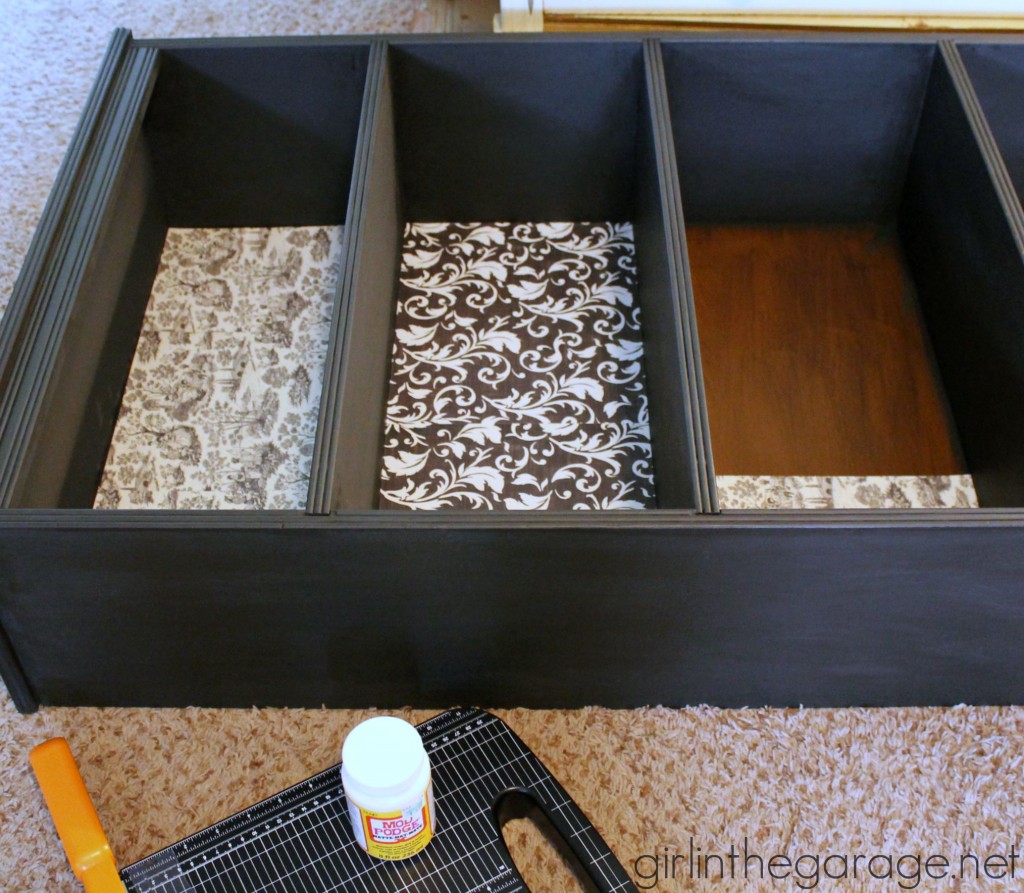 Decoupage Bookcase: How to update a boring bookcase with paint, pretty paper, and Mod Podge. girlinthegarage.net