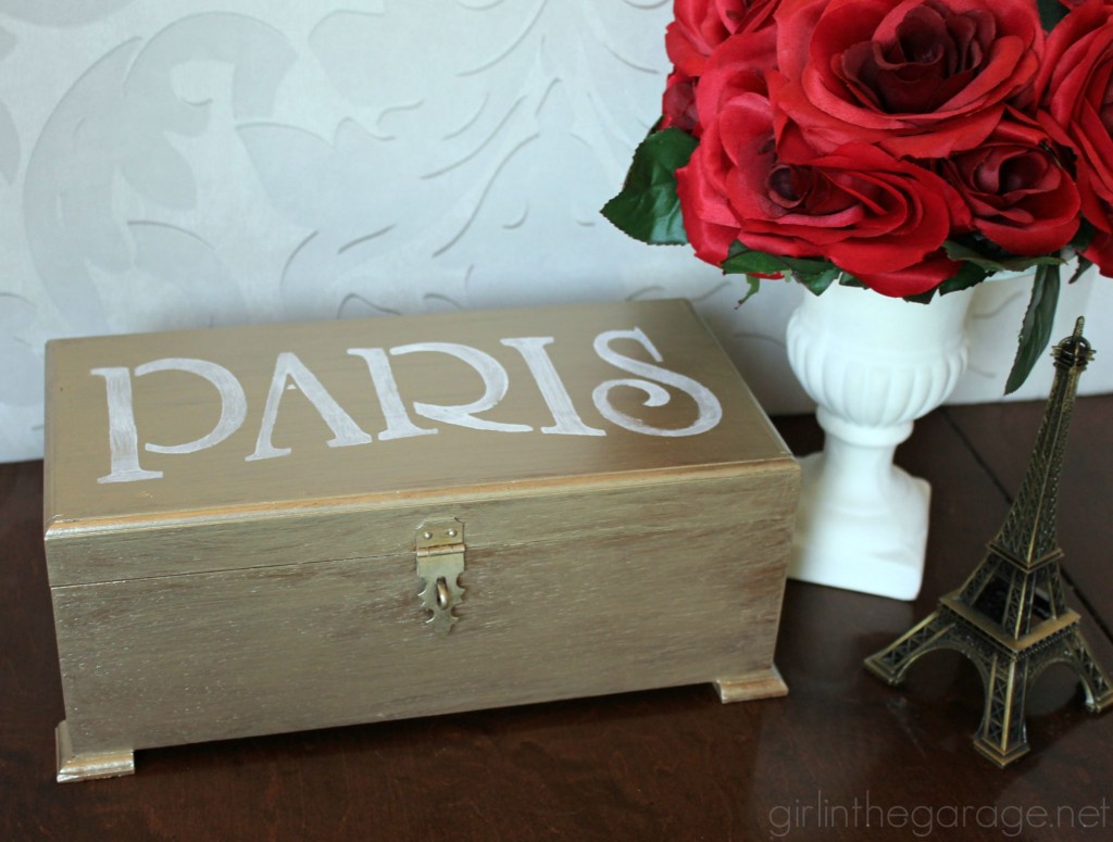 Metallic paint and a Paris stencil glam up a yard sale jewelry box.  girlinthegarage.net