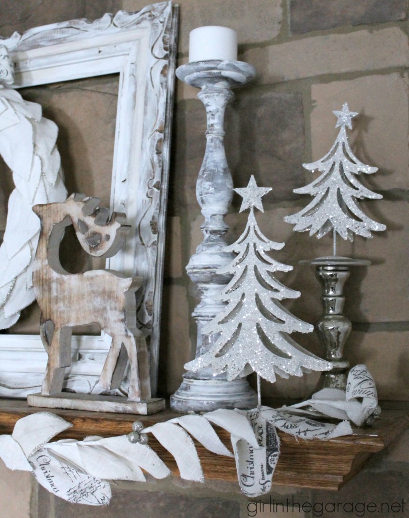 Christmas mantel decorated in white for a winter wonderland theme.