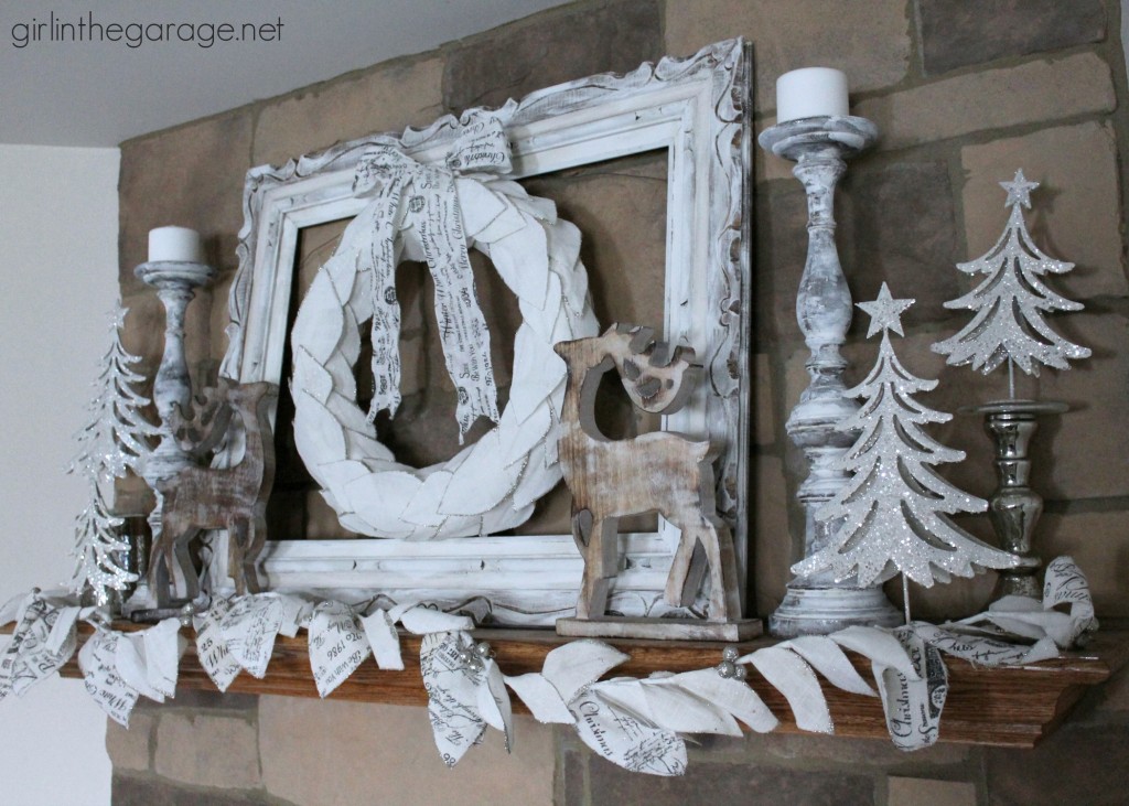 Christmas mantel decorated in white for a winter wonderland theme.