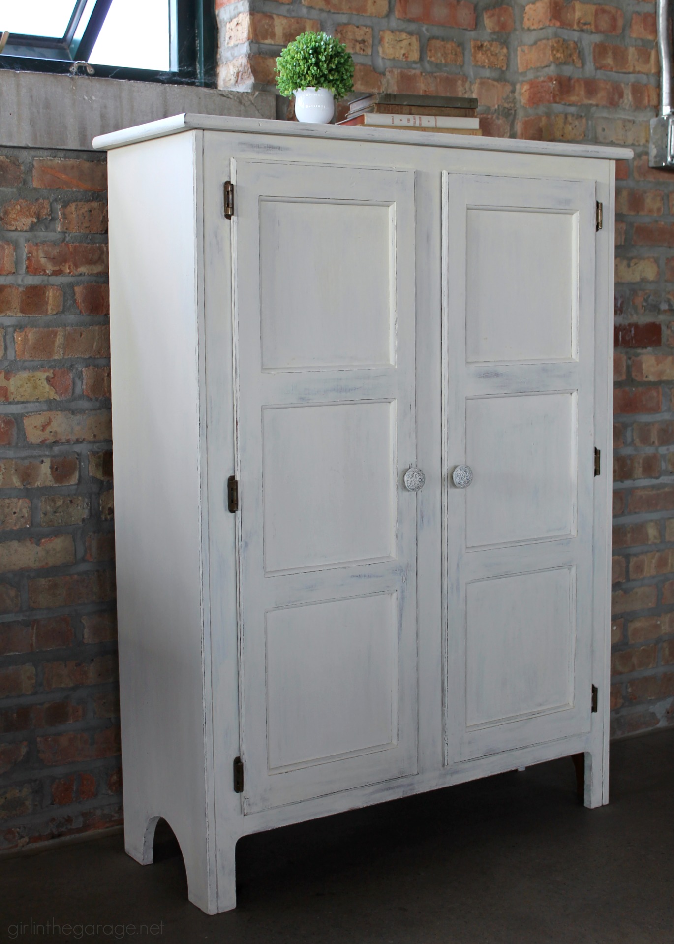 Primitive storage cabinet makeover with Chalk Paint and lightly distressed. By Girl in the Garage