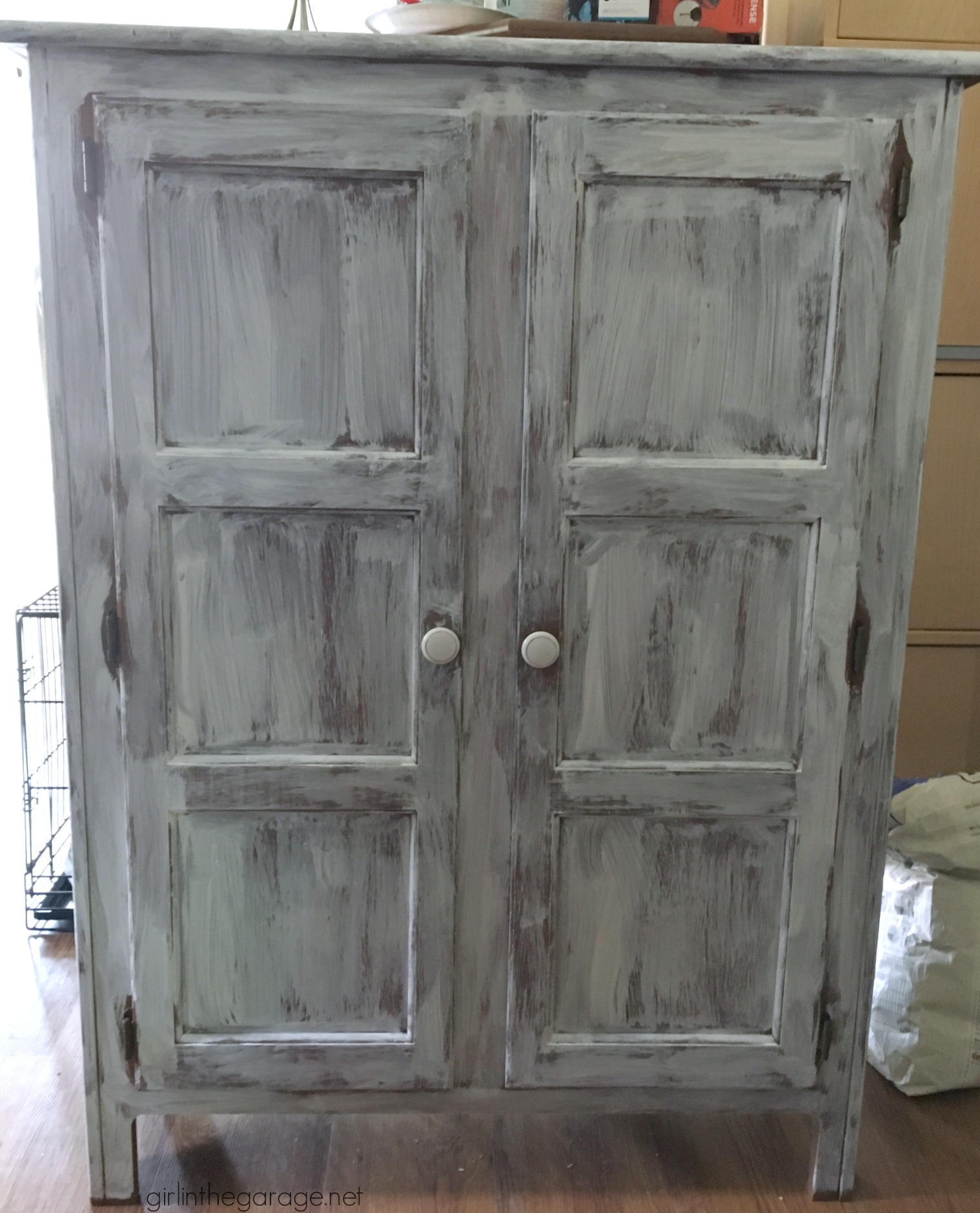 Primitive storage cabinet makeover with Chalk Paint and lightly distressed. By Girl in the Garage