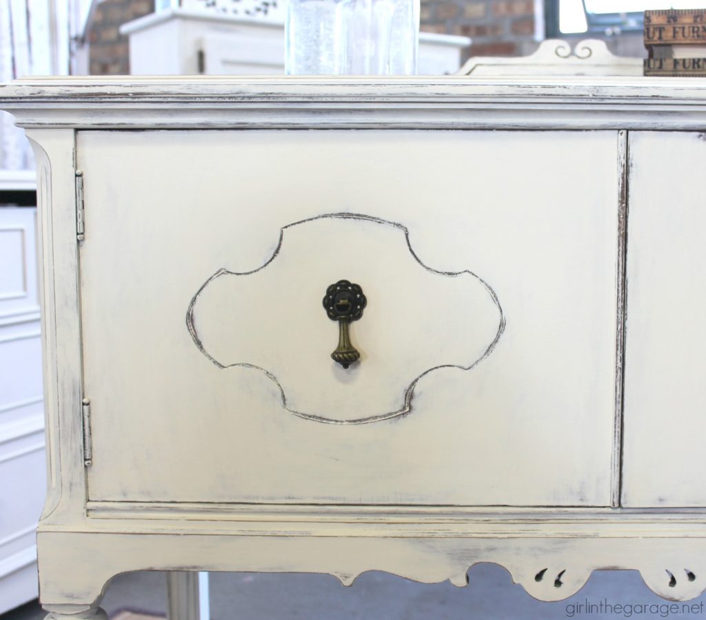 Antique sideboard makeover. How to paint a beautiful white distressed finish with Chalk Paint. By Girl in the Garage