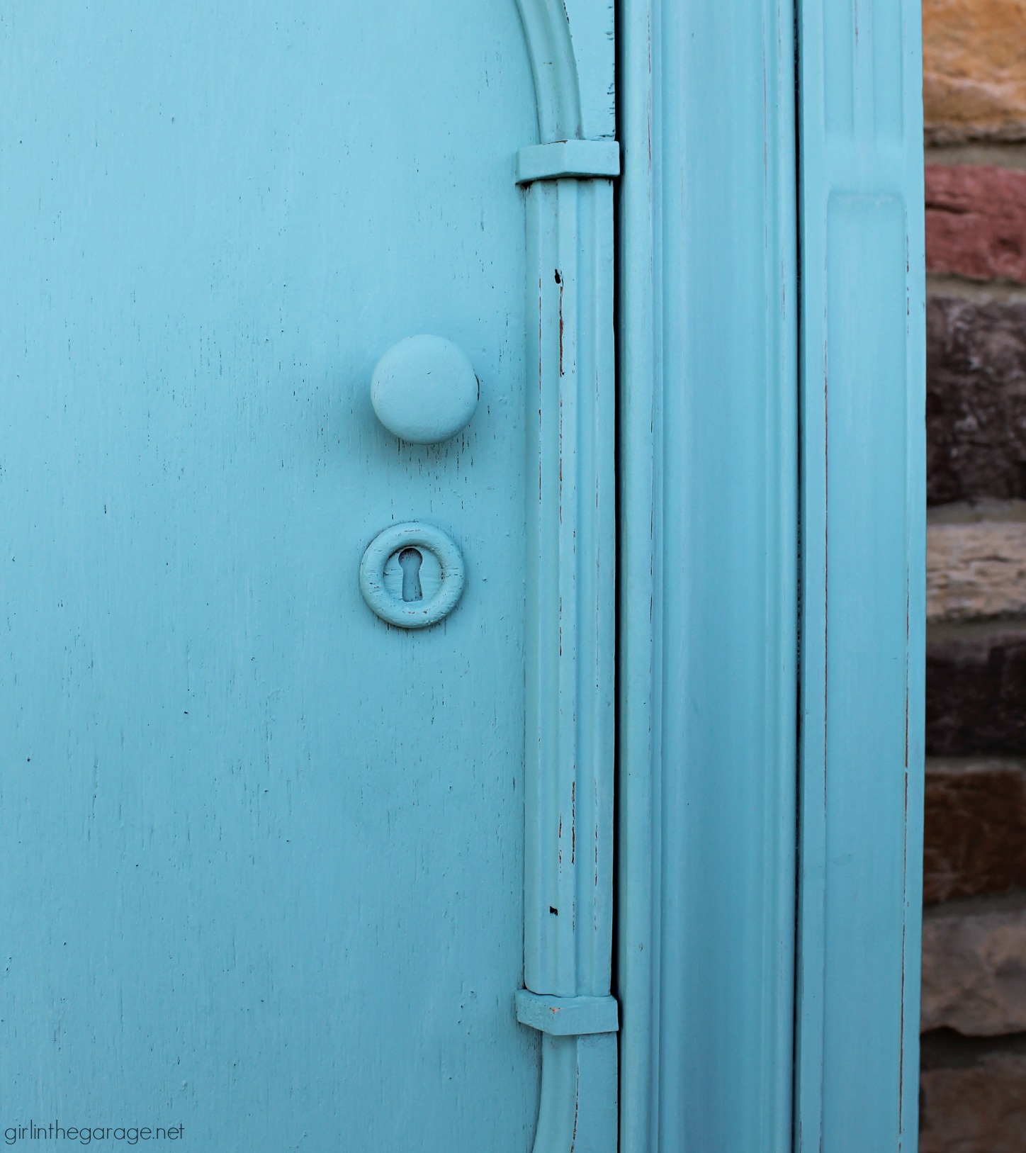 Thrifted repurposed radio cabinet makeover to storage cabinet with shelves. Painted in Annie Sloan Chalk Paint in Provence turquoise. DIY tutorial by Girl in the Garage.