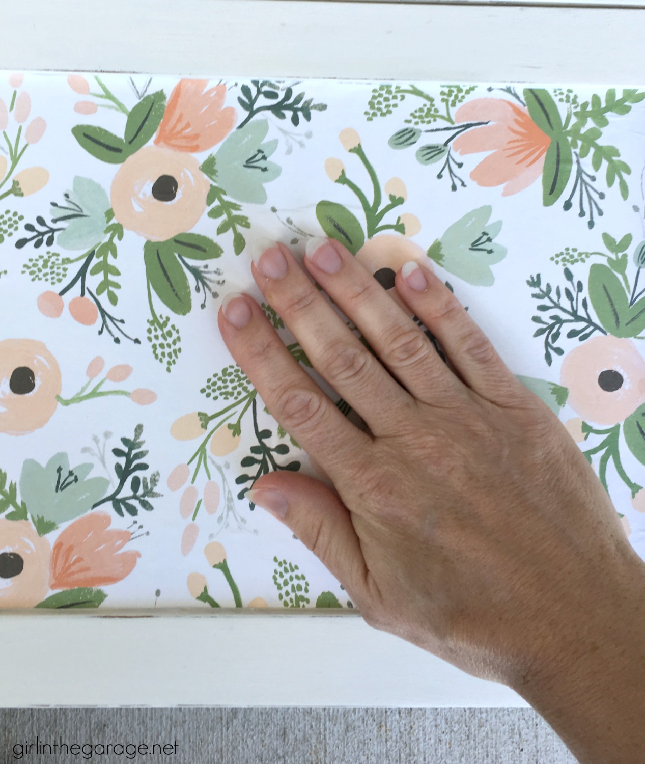 Yard sale cabinet gets a pretty papered cabinet makeover with decoupage Rifle Paper Co wrapping paper and Chalk Paint. DIY Tutorial by Girl in the Garage