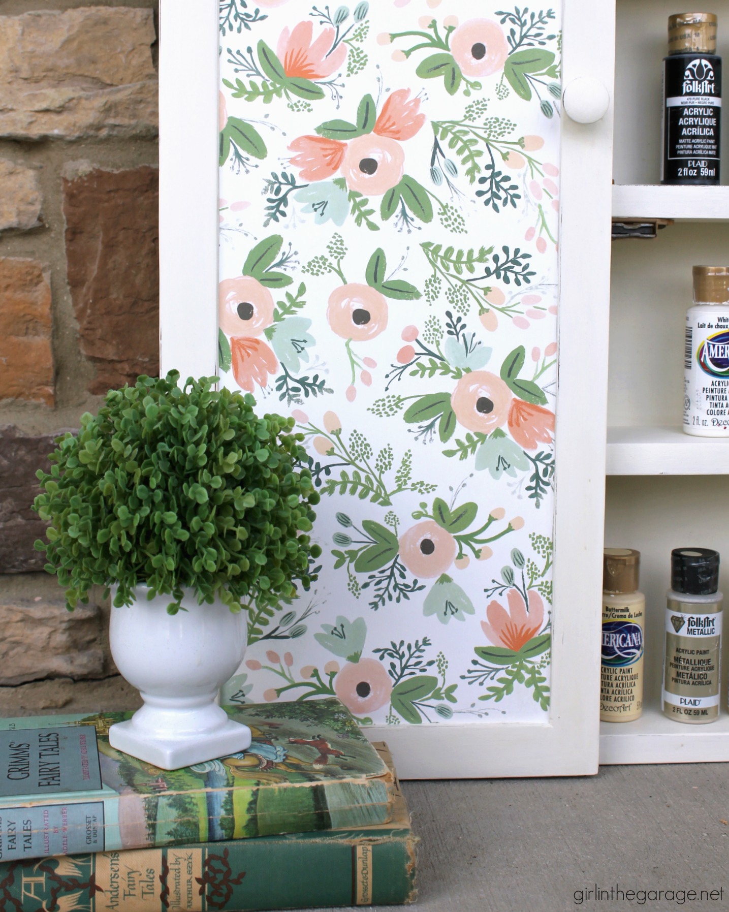 Yard sale cabinet gets a pretty papered cabinet makeover with decoupage Rifle Paper Co wrapping paper and Chalk Paint. DIY Tutorial by Girl in the Garage