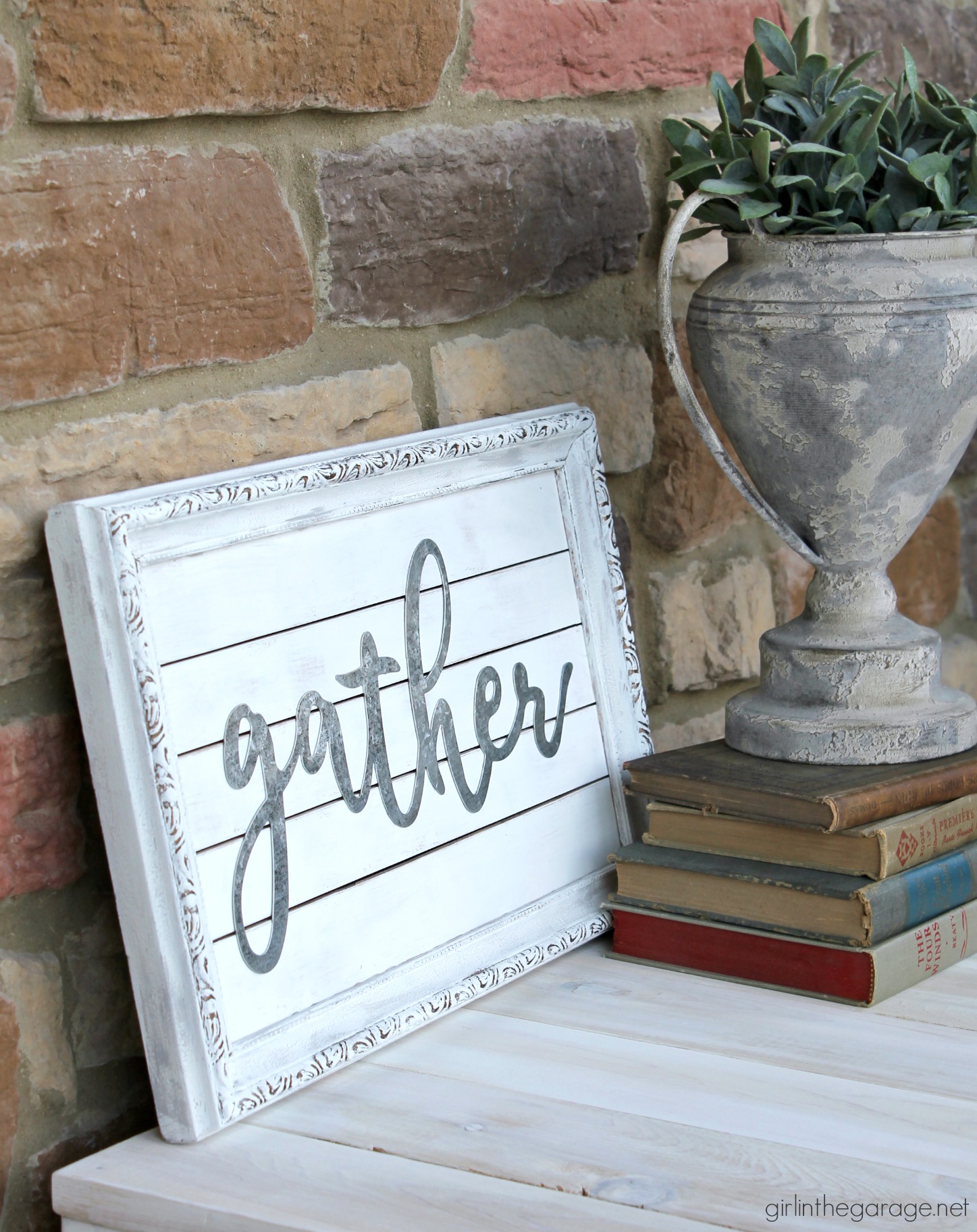 Thrifted art makeover repurposed into a planked farmhouse Gather sign. Easy DIY home decor tutorial by Girl in the Garage.