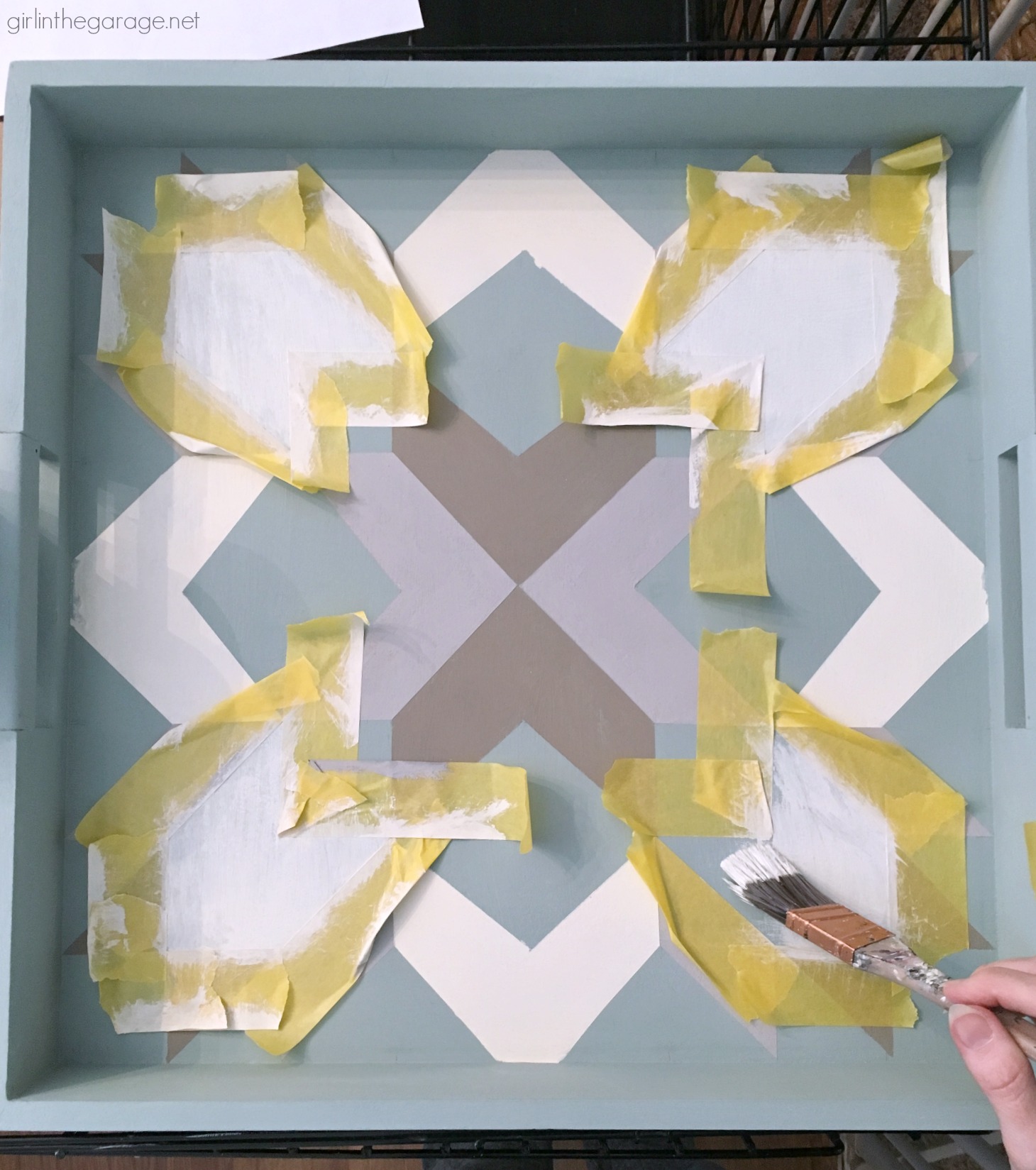 How to paint a barn quilt on a thrifted tray for a beautiful art piece. Step by step DIY tutorial by Girl in the Garage.