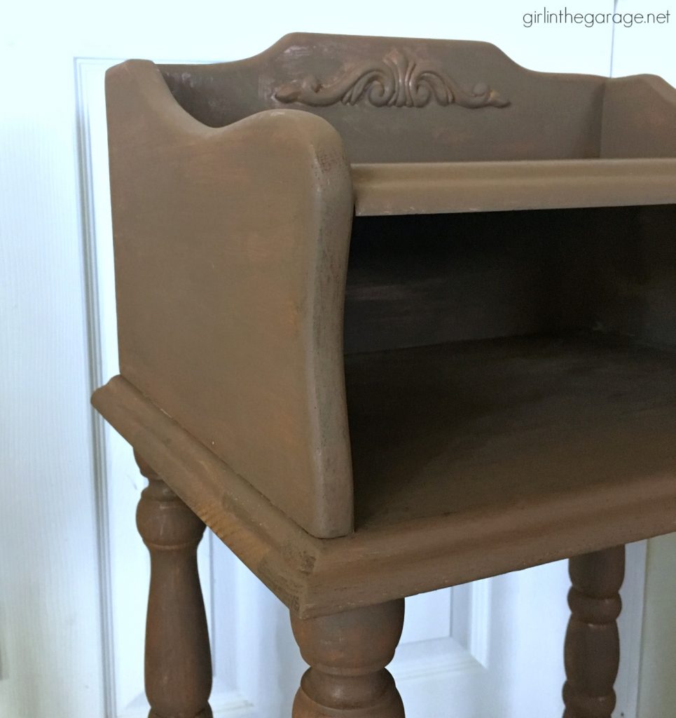 This updated telephone table was rescued from the thrift store and painted pink Chalk Paint. Now it's happy and living its best life. By Girl in the Garage