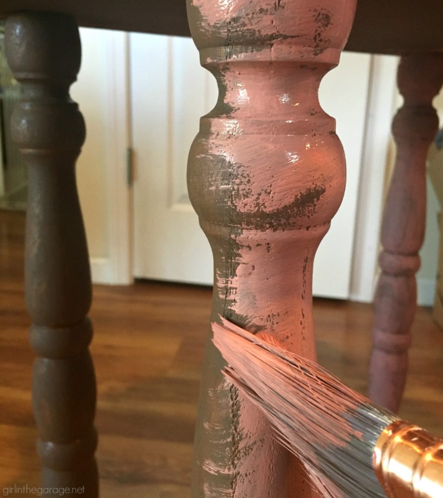 This updated telephone table was rescued from the thrift store and painted pink Chalk Paint. Now it's happy and living its best life. By Girl in the Garage