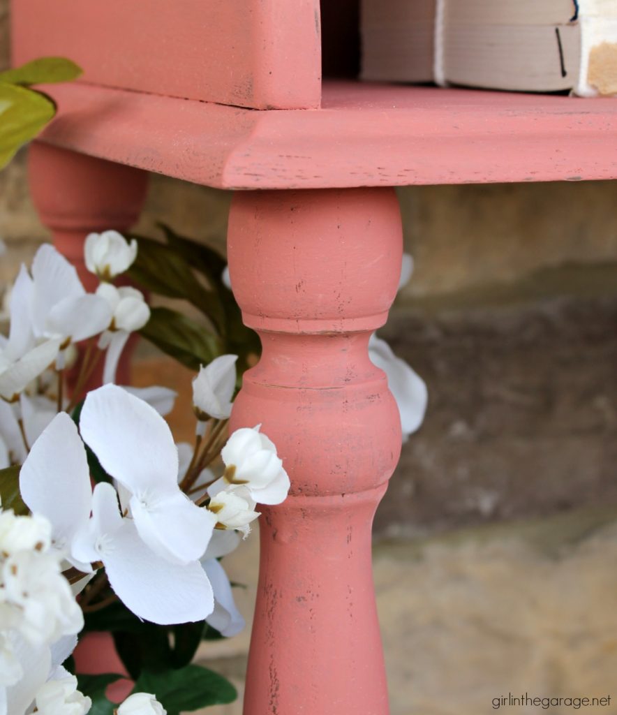 This updated telephone table was rescued from the thrift store and painted pink Chalk Paint. Now it's happy and living its best life. By Girl in the Garage