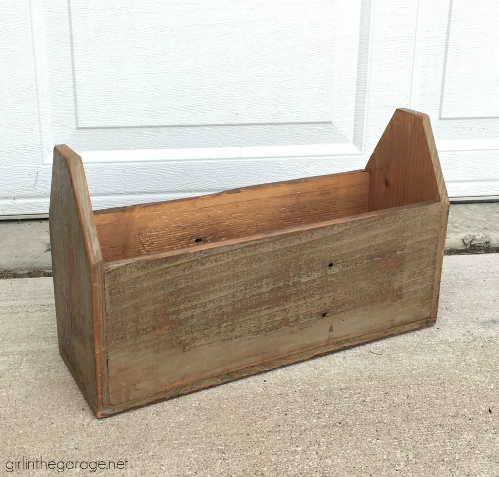 Wooden tote box makeover with a beautiful rustic French vibe - dry brushing, stencil, and wood appliques. DIY tutorial by Girl in the Garage