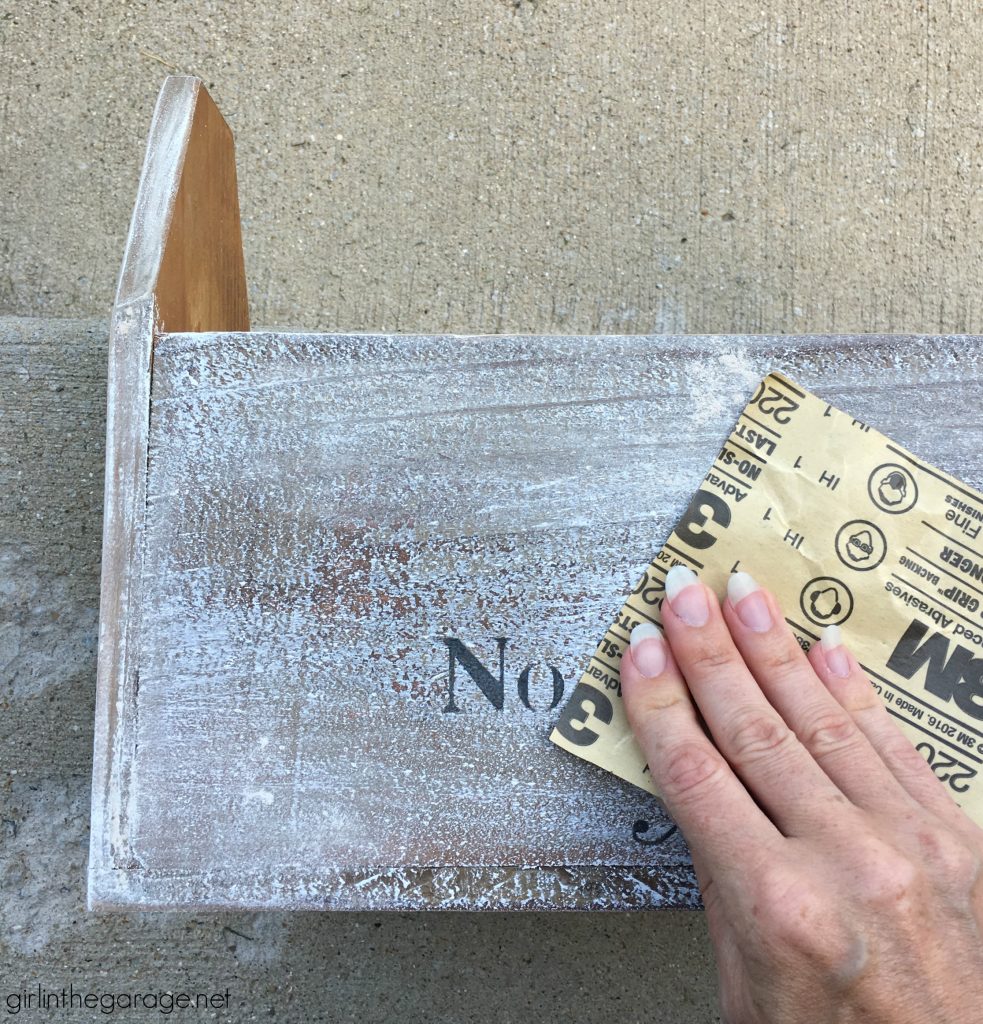 Wooden tote box makeover with a beautiful rustic French vibe - dry brushing, stencil, and wood appliques. DIY tutorial by Girl in the Garage