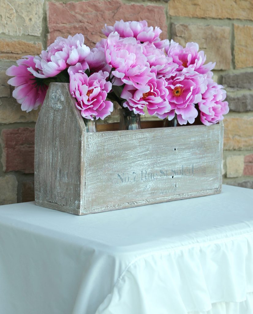 Wooden tote box makeover with a beautiful rustic French vibe - dry brushing, stencil, and wood appliques. DIY tutorial by Girl in the Garage