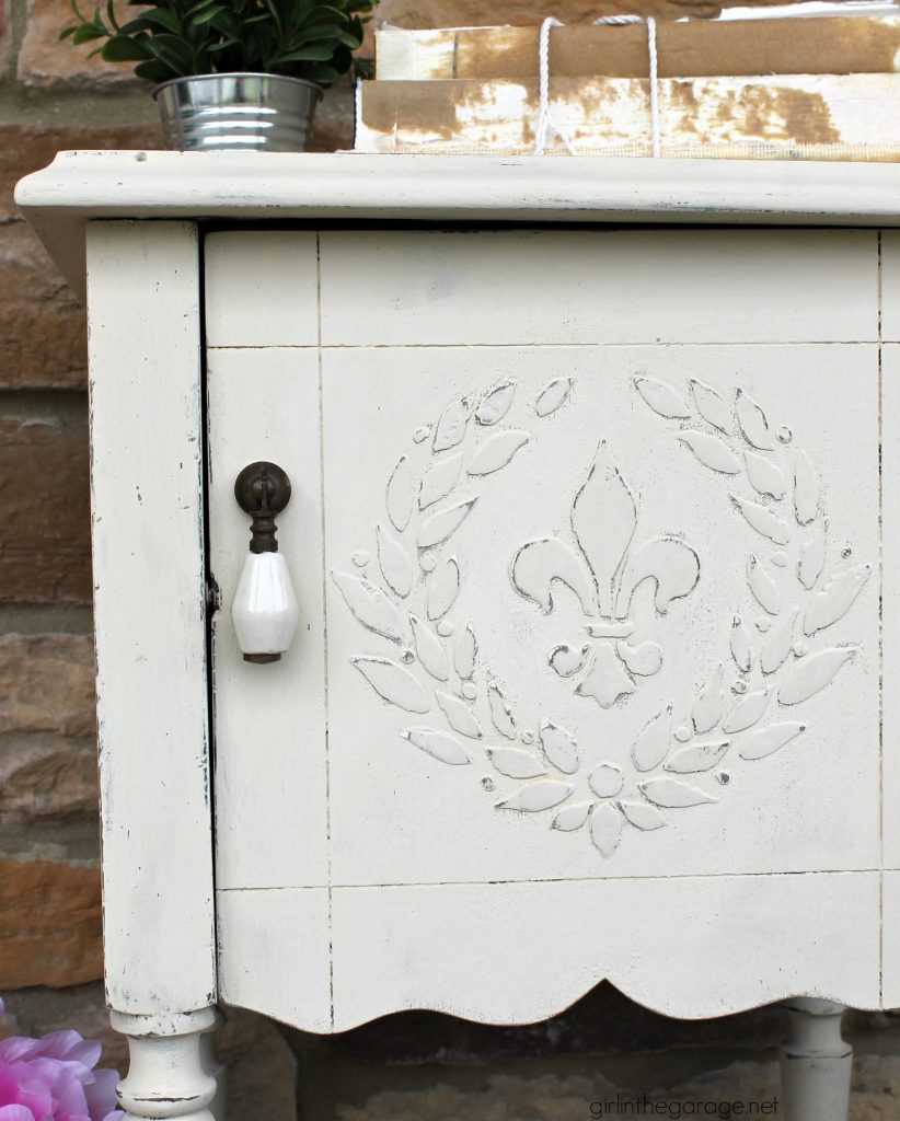 Add amazing custom texture with a raised stencil furniture makeover using spackling from the hardware store. Step by step DIY tutorial for custom embossed furniture by Girl in the Garage.