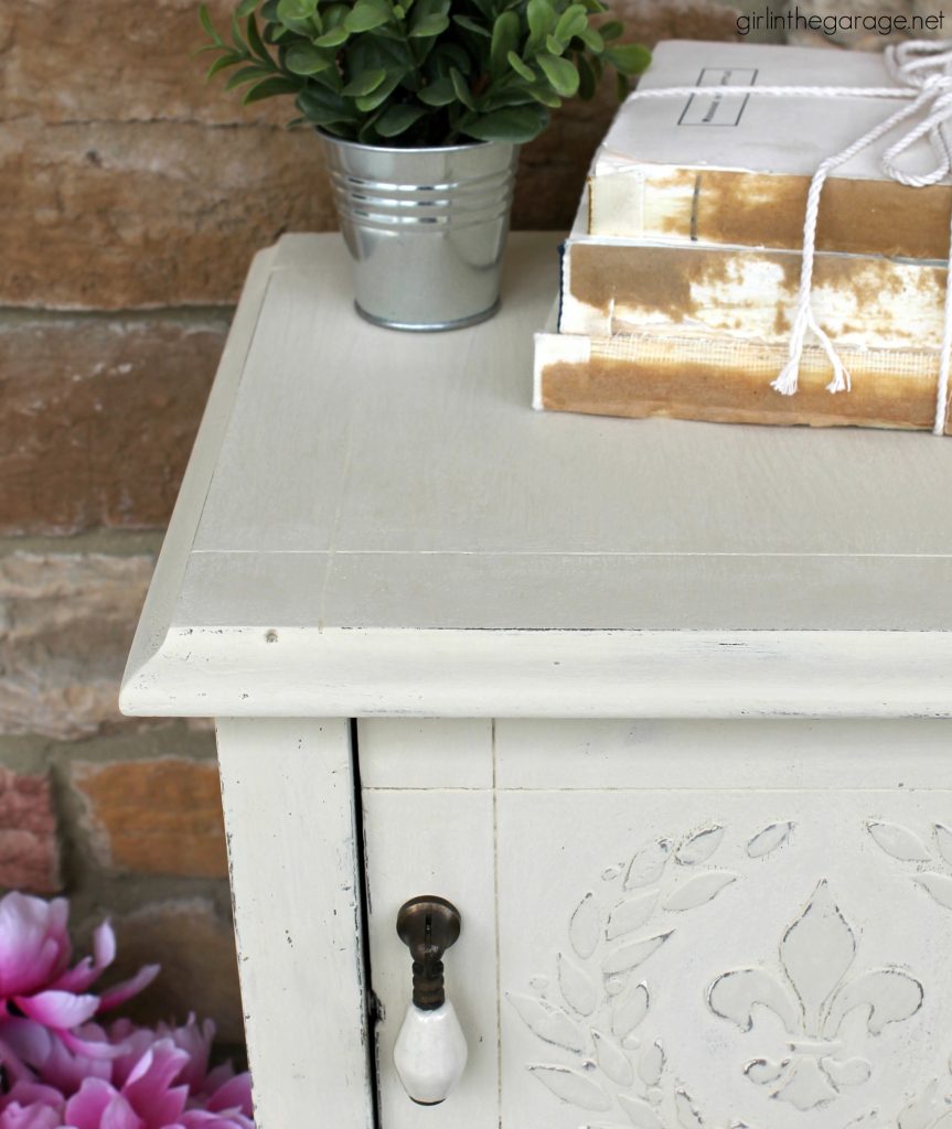 Add amazing custom texture with a raised stencil furniture makeover using spackling from the hardware store. Step by step DIY tutorial for custom embossed furniture by Girl in the Garage.