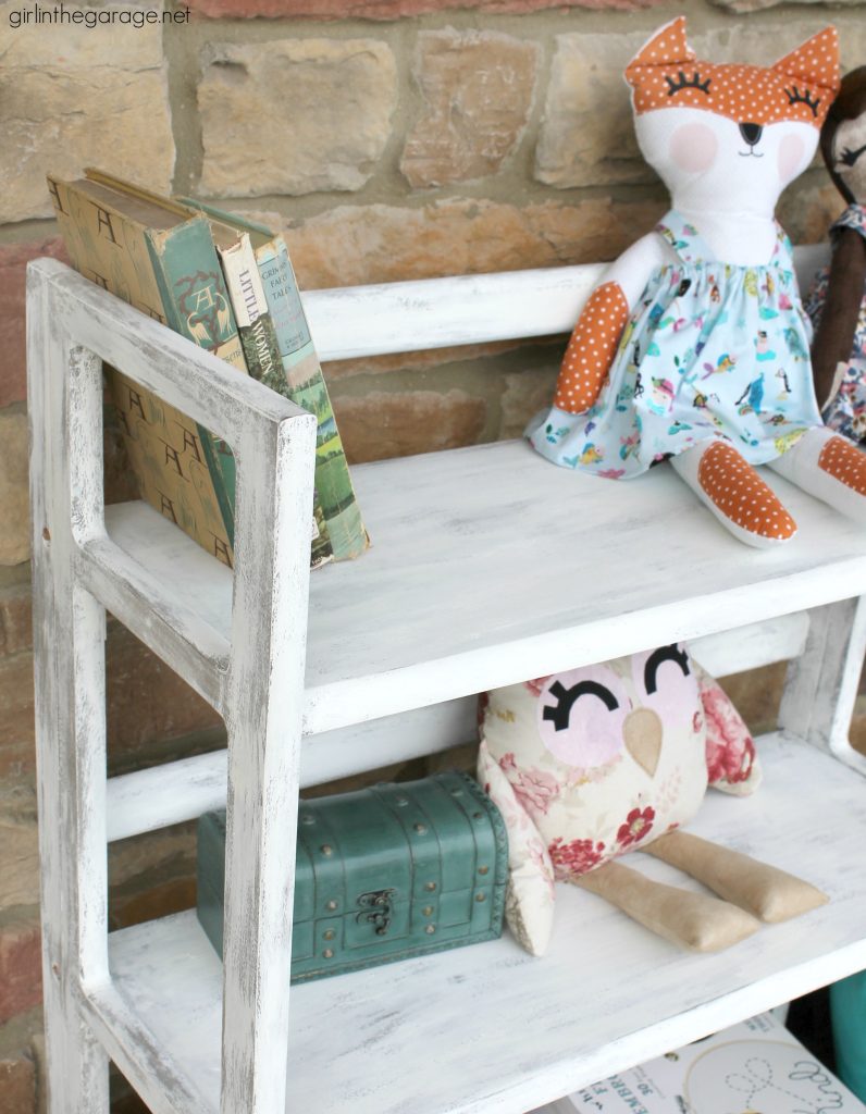 Craft fair necessity: A DIY painted folding bookcase - portable and sets up in seconds. Paint a folding bookcase to match your market booth's style. by Girl in the Garage