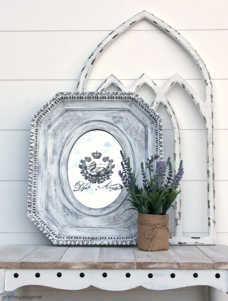 Easily update a thrifted mirror with this painted mirror makeover tutorial with rub-on image transfer. Get a dramatic look with little effort. By Girl in the Garage