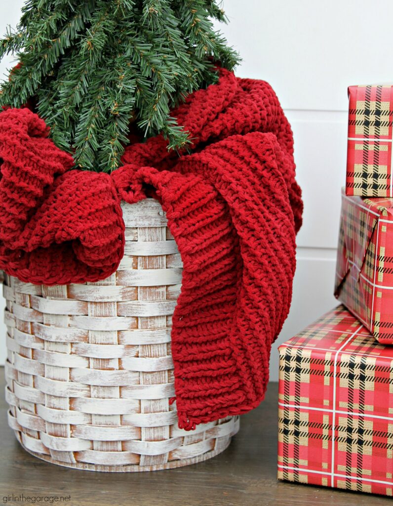 For cozy Christmas decor, learn how to use a thrifted basket as a DIY Christmas tree basket stand. An easy project with beautiful results. DIY furniture makeover and decor ideas by Girl in the Garage