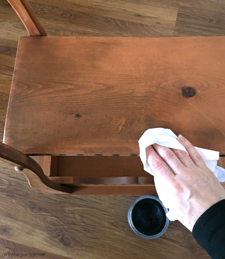 Love the black wood stain look? Learn how to stencil a table and easily stain wood black with furniture wax. By Girl in the Garage